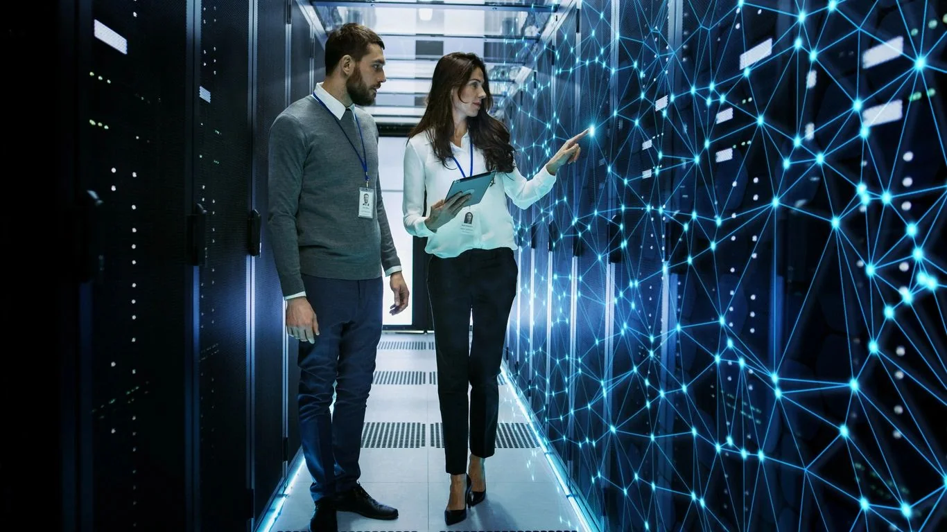 Technology specialists discussing connected systems